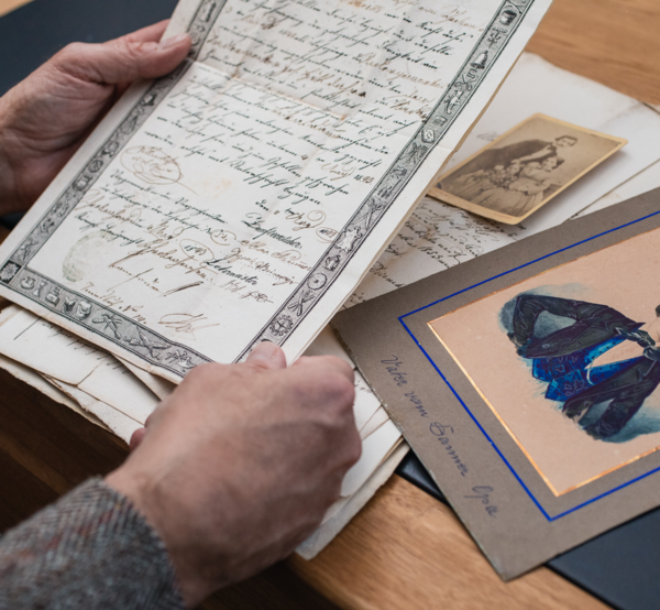 View of an old manuscript; below it are further archival documents from the collection of the tailor Lukas Danner.