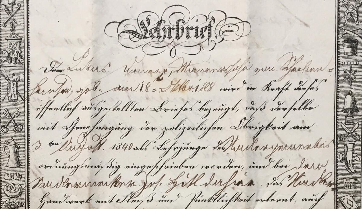 Closeup of the document of Lukas Danner's indenture as a needle-maker apprentice, dated 1843.