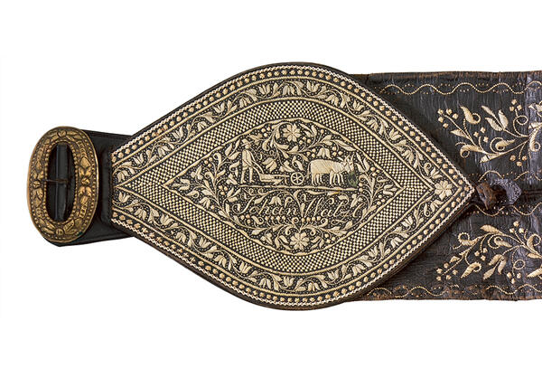 Detailed view of a brown leather belt from the Innviertel, dated about 1840, elaborately decorated with quill embroidery.